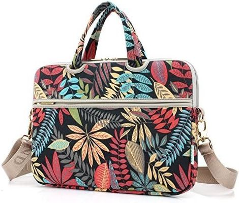 Laptop bag designed for 12.5 to 14 inch laptops with padded interior printed canvas fabric and multiple carrying options