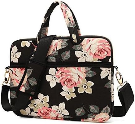 Laptop bag designed for 12.5 to 14 inch laptops with padded interior printed canvas fabric and multiple carrying options