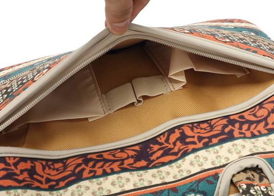 Laptop bag designed for 12.5 to 14 inch laptops with padded interior printed canvas fabric and multiple carrying options