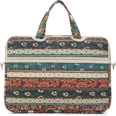 Laptop bag designed for 12.5 to 14 inch laptops with padded interior printed canvas fabric and multiple carrying options